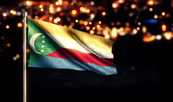 Comoros National Flag City Light Night Bokeh Background 3D — Stock Photo, Image