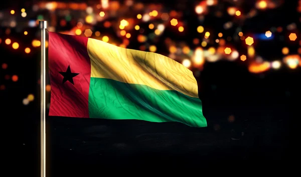 Гвінея Бісау Національний прапор місто світло вночі Боке тло 3d — стокове фото
