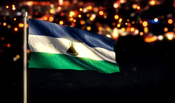 Lesotho nationale Flagge Stadt Licht Nacht Bokeh Hintergrund 3d — Stockfoto