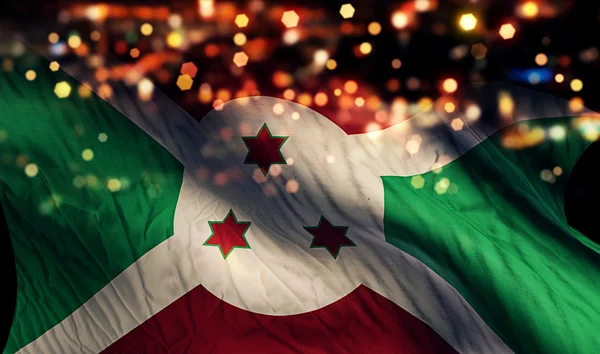 Národní vlajka Burundi světlo v noci Bokeh abstraktní pozadí — Stock fotografie