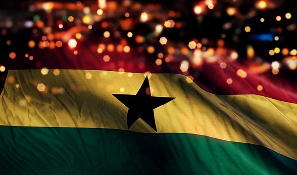 Ghana flagga ljus natt Bokeh abstrakt bakgrund — Stockfoto
