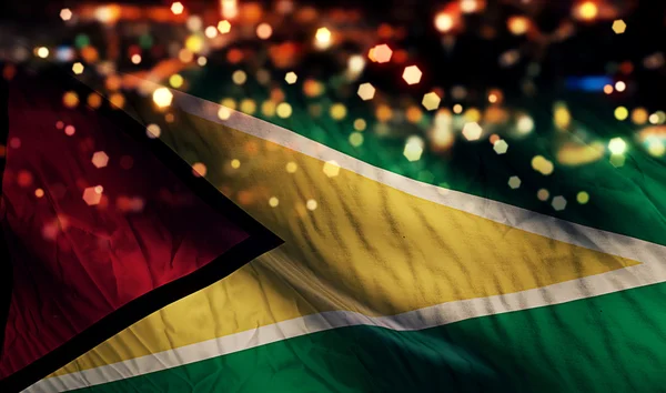 Guyana Nationalflagge Licht Nacht Bokeh abstrakten Hintergrund — Stockfoto