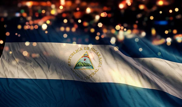 Nicaragua Bandiera Nazionale Luce Notte Bokeh Sfondo astratto — Foto Stock