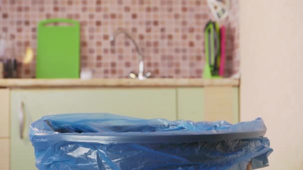 Plastic bottle is thrown into the trash bin — Vídeos de Stock