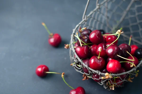 Cherries on black table — Stock Photo, Image