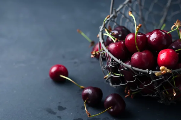Cherries on black table — Stock Photo, Image