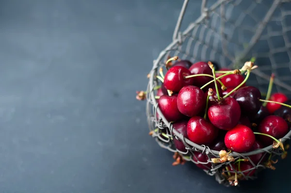 Cherries on black table — Stock Photo, Image