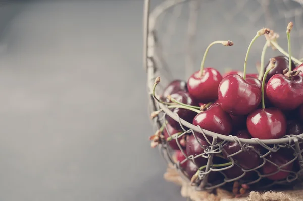 Cherries on black table — Stock Photo, Image