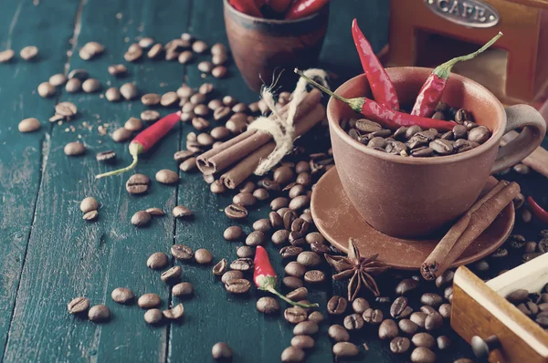 Coffee beans and red chilly peppers. Tonned photo — Stock Photo, Image