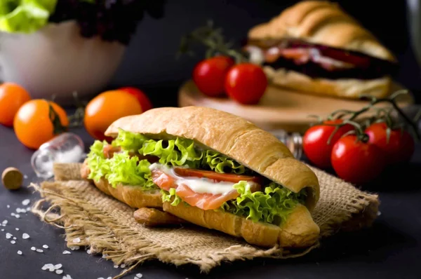 Croissant sandwich with salted salmon — Stok fotoğraf