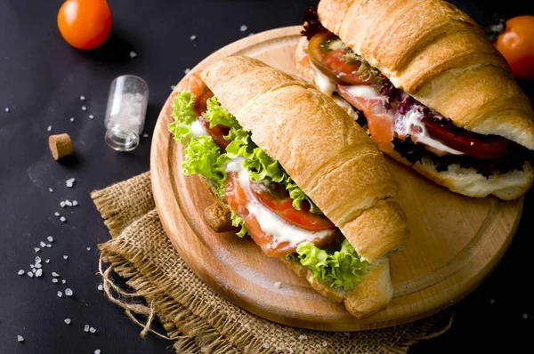 Croissant sandwich with salted salmon — Stok fotoğraf