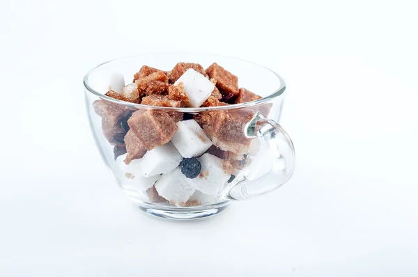 Cubes of sugar and spices in a cup — Stock Photo, Image
