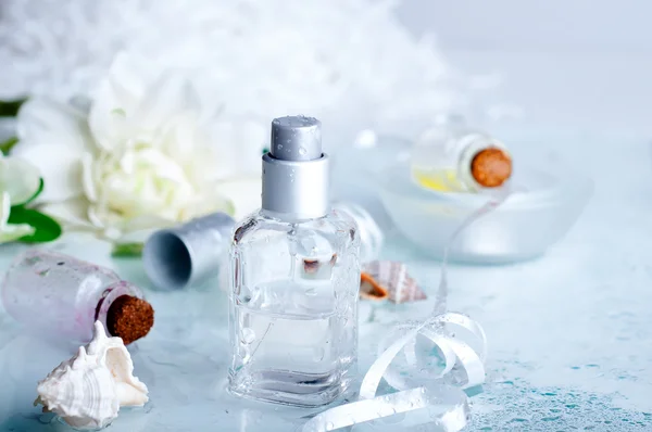 Perfume bottles  with water backgraund — Stock Photo, Image