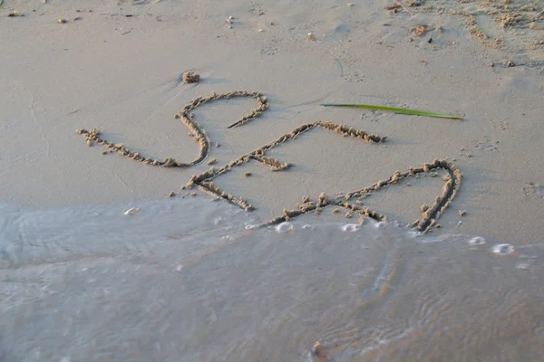 Sign in the sand — Stock Photo, Image