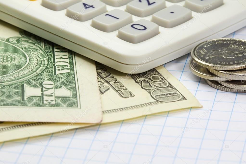 Business calculator and money closeup