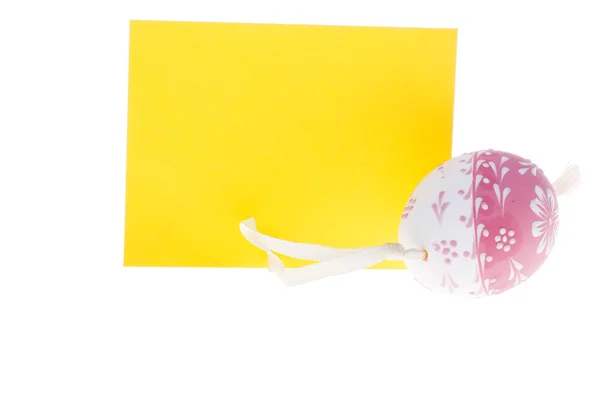 Detail of isolated yellow wish card and Easter egg — Stock Photo, Image