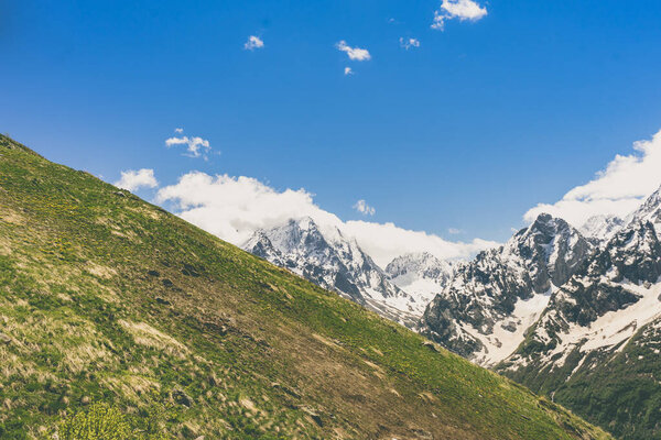Great nature mountain landscapes. Fantastic perspective of caucasian snow inactive volcano Elbrus and clearly blue sky background. Russia