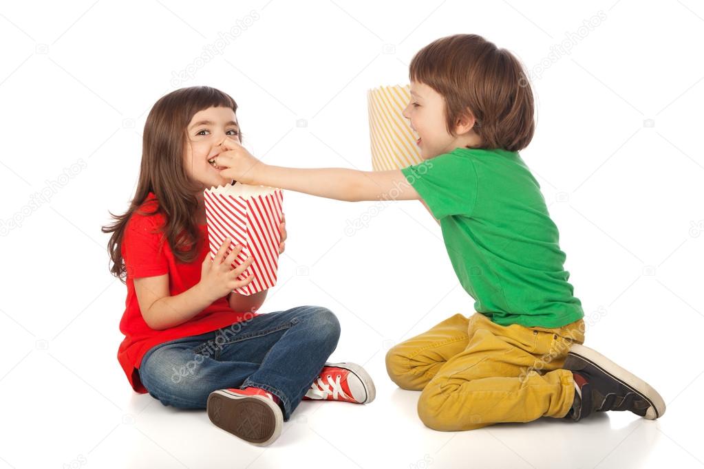 Children eating popcorn