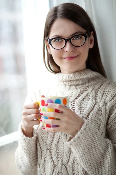 Enjoying tea by the window — Stock Photo, Image