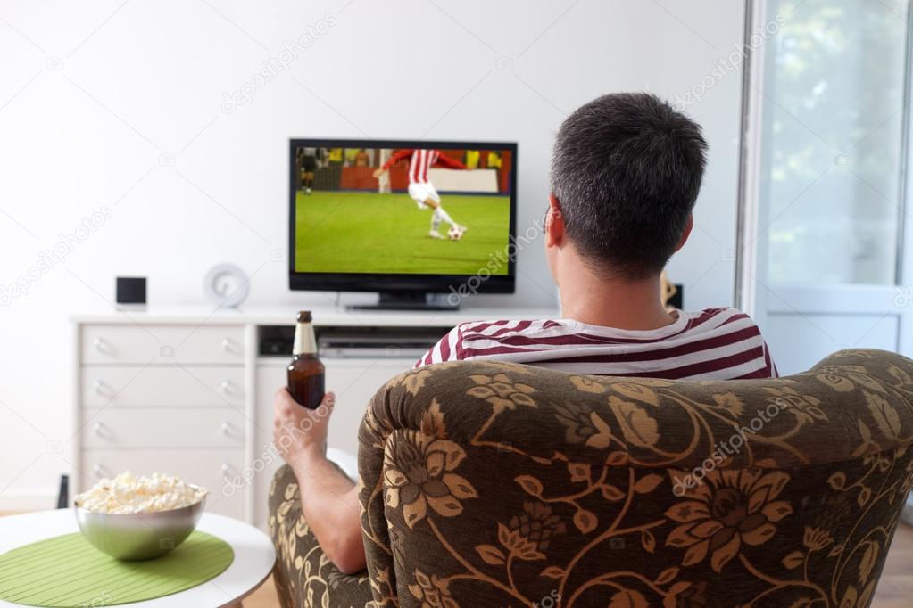 Young man watching sports