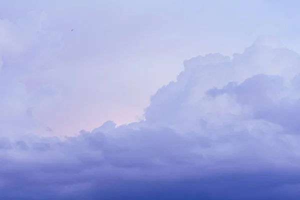 Purple violet sky sunset, dusk clouds in pastel colors in the evening sky background