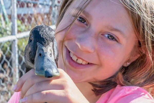 Close Cute Little Girl Freckles She Holds Her Pet Duck — Stock Photo, Image