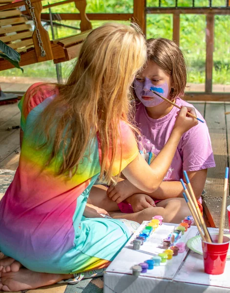 Two Sisters Paint Each Others Faces Sit Screen Porch — Stock Photo, Image