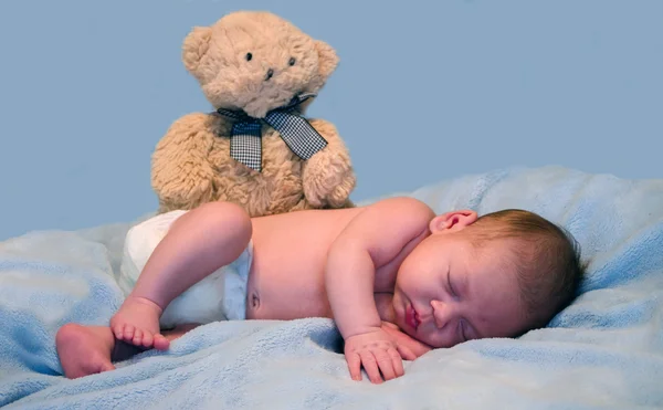 Baby and teddy bear — Stock Photo, Image