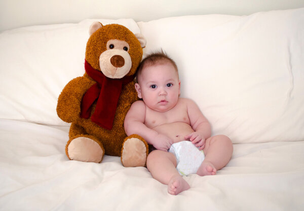 Teddy bear and serious baby boy