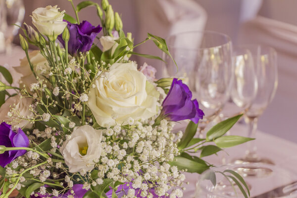 Premium catering arrangement with flowers and glasses