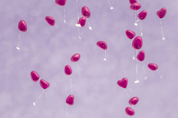 Ballons coeur rose dans le ciel - symbole de l'amour — Photo