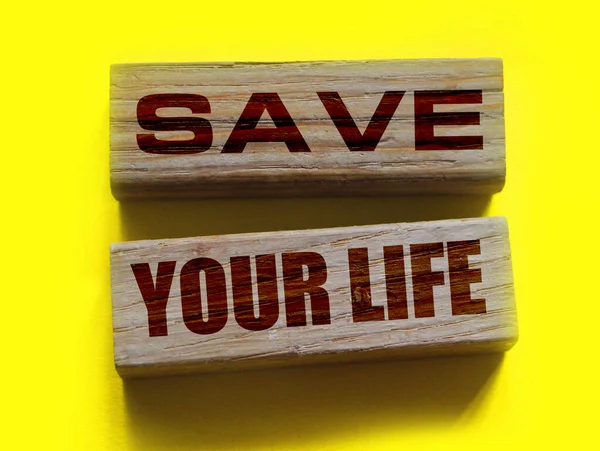 Save your life words written on wood block., Top view lifestyle healthcare medical concept.