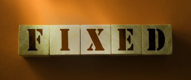 Tahta blokta sabitlenmiş kelime. İş muhasebe finansal konsepti.