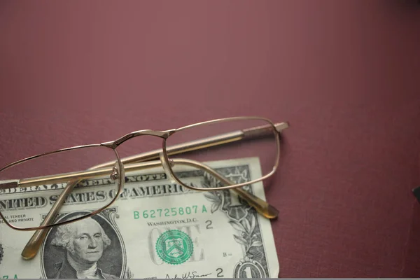 One Dollar Bill Glasses Dark Red Background Financial Concept — Stock Photo, Image