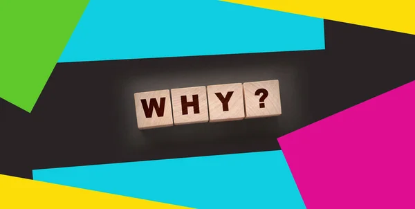 Why Closeup of word with question mark on wooden cubes on dark grey desk background. Reason why business or relationship concept.