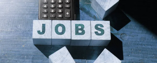 Jobs Palavra Feita Com Blocos Madeira Mesa Com Calculadora Trabalho — Fotografia de Stock