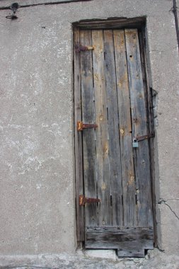 Hanging lock on ancient vintage door. locked old wooden door. 