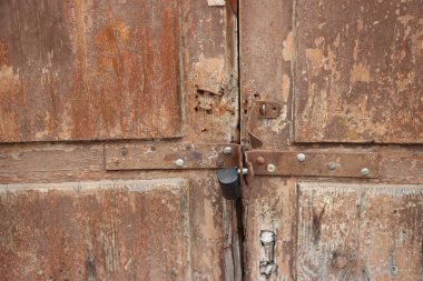 Hanging lock on ancient vintage door. locked old wooden door. 