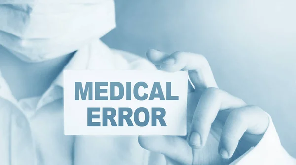 Doctor holding a card with Medical Error, Medical concept.
