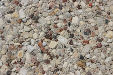 Çakıl taşları görüntüyü kapatır, gri doğal düzensiz taşlar endüstriyel arka planı şekillendirir