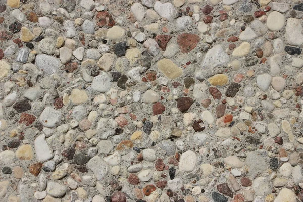 pebbles close up view, grey natural irregular stones texture industrial style background