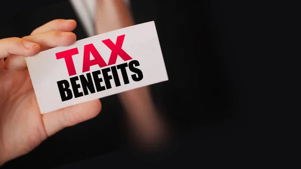 Businessman Shows Card Text Tax Benefits Taxes Fees Policy Regulation — Stock Photo, Image