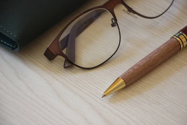 Business Concept Eyeglasses Pen Wooden Background — Foto Stock