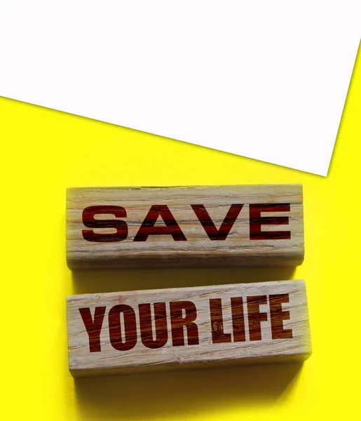 Save your life words written on wood block., Top view lifestyle concept