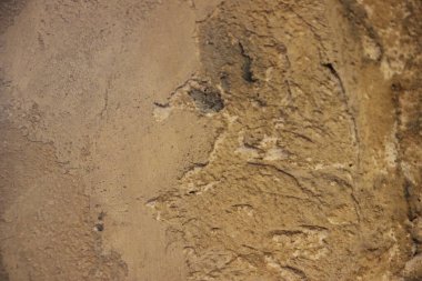 İnce detaylarla kiri ya da çamuru andıran desenli kahverengi yüzeye yakın çekim.