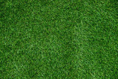 Yeşil yapay çimenlerin dokusu. Spor stadyumlarını ve dekorasyonları kapsıyor..