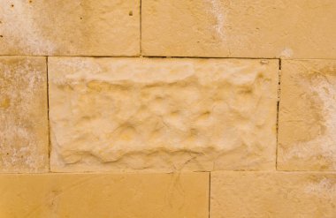 Taşın dokusu bej. Kaya, dekoratif taş. Taşın pürüzlü dokusu. Arkaplan ve doku.