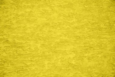Duvardaki alçının dokusunu. Sarı rengin pürüzlü ve pürüzlü yüzeyi. 2021 eğiliminde arka plan.
