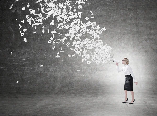 Woman with a loudspeaker — Stock Photo, Image