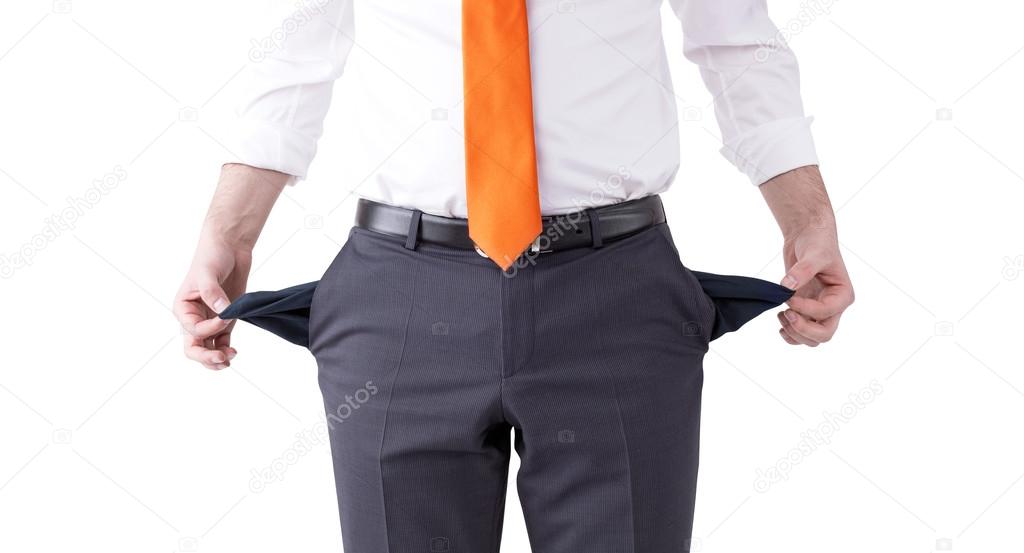 A businessman with an orange tie turning his empty pockets inside out. Front view, no head. Isolated. Concept of bankruptcy.